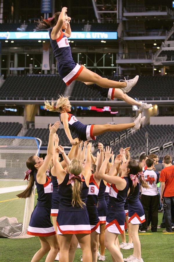 The cheerleaders perform stunts during the playoff game against South Oak Cliff HS on Nov. 21 at AT&T Stadium. 