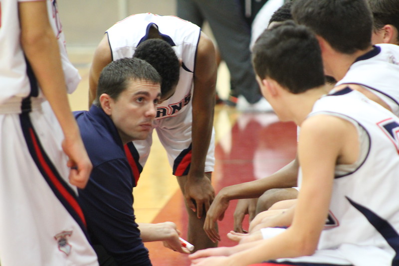 Coach Wilson talking to JV during at timeout. (Photo by Sandra Fallgatter)
