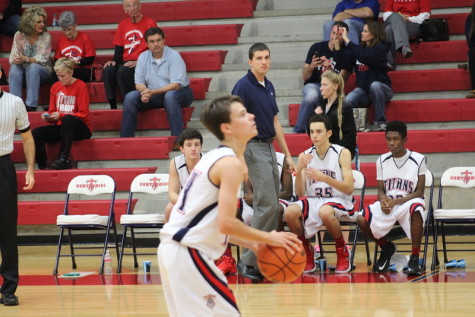 Coach Wilson watching Preston attempt a free throw against Mesquite Poteet. 