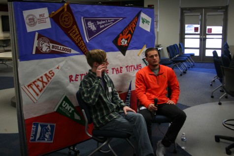 Benjamin Braudrick and Nick Baril sit down while being interviewd