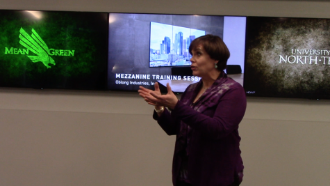 Administrator Brenda Sims explaining explains the technology available at the new UNT branch in Frisco.