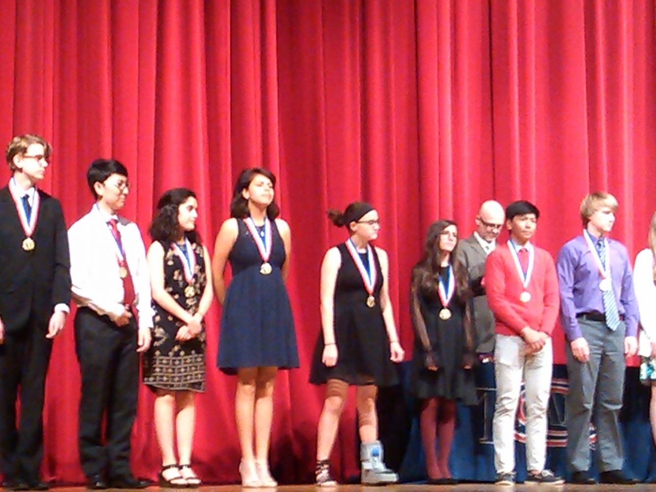 Students honored on stage at the awards ceremony. 