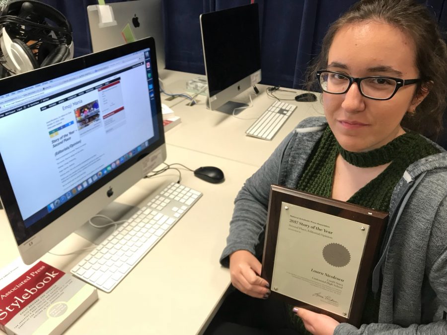 Laura+Nicolescu+displays+her+plaque+for+2nd+Place+in+Story+of+the+Year+for+the+NSPA+National+Convention