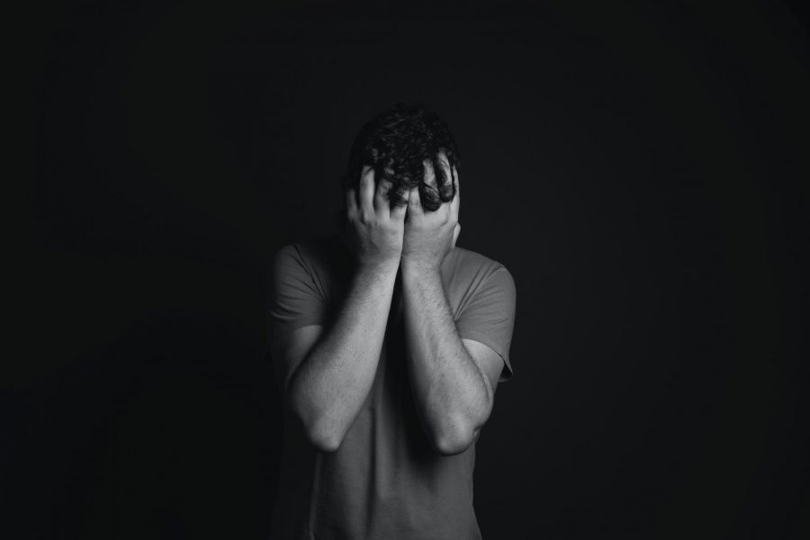 Overwhelmed Man with Face in Hands, Source: Daniel Reche, pexels.com