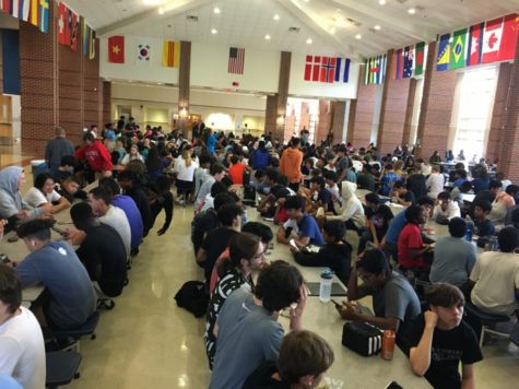 Centennial High School students sitting and eating in a crowded cafeteria