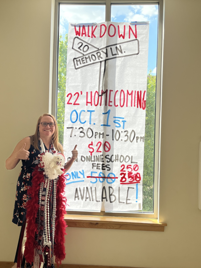 Mrs.+Gillespie+with+her+mum+standing+in+front+of+a+homecoming+poster