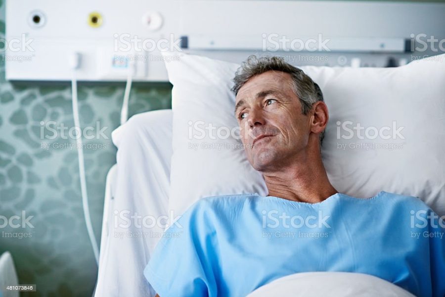 A man in a hospital bed