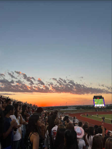 Sun sets over Kuykendall stadium as Centennials homecoming game begins.