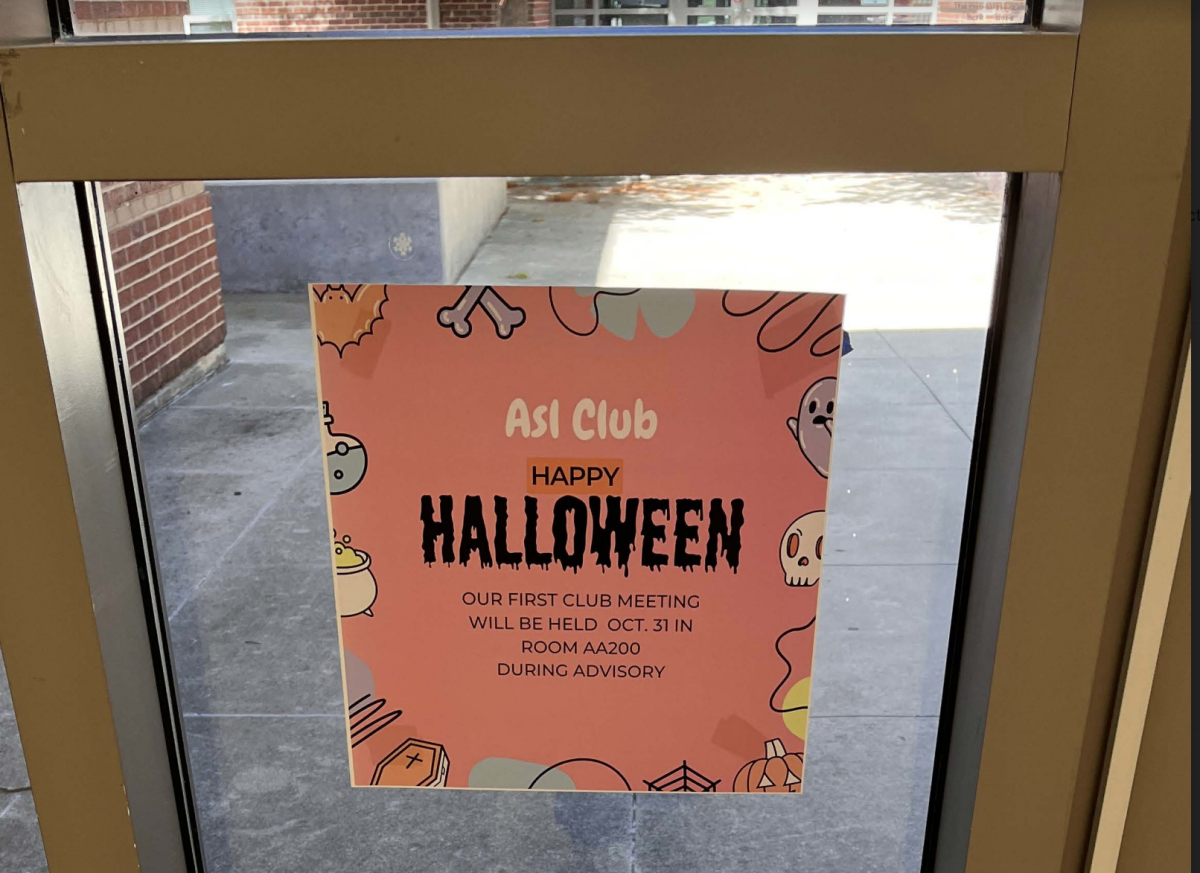 A poster of the ASL clubs first meeting of the year being held in AA hall.