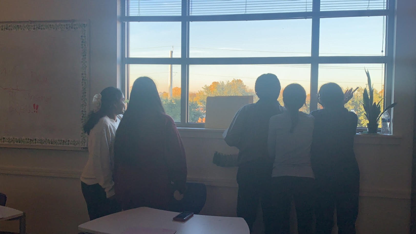 Students at December’s Book Club meeting, enjoying time with each other before discussing the Book Drive. 