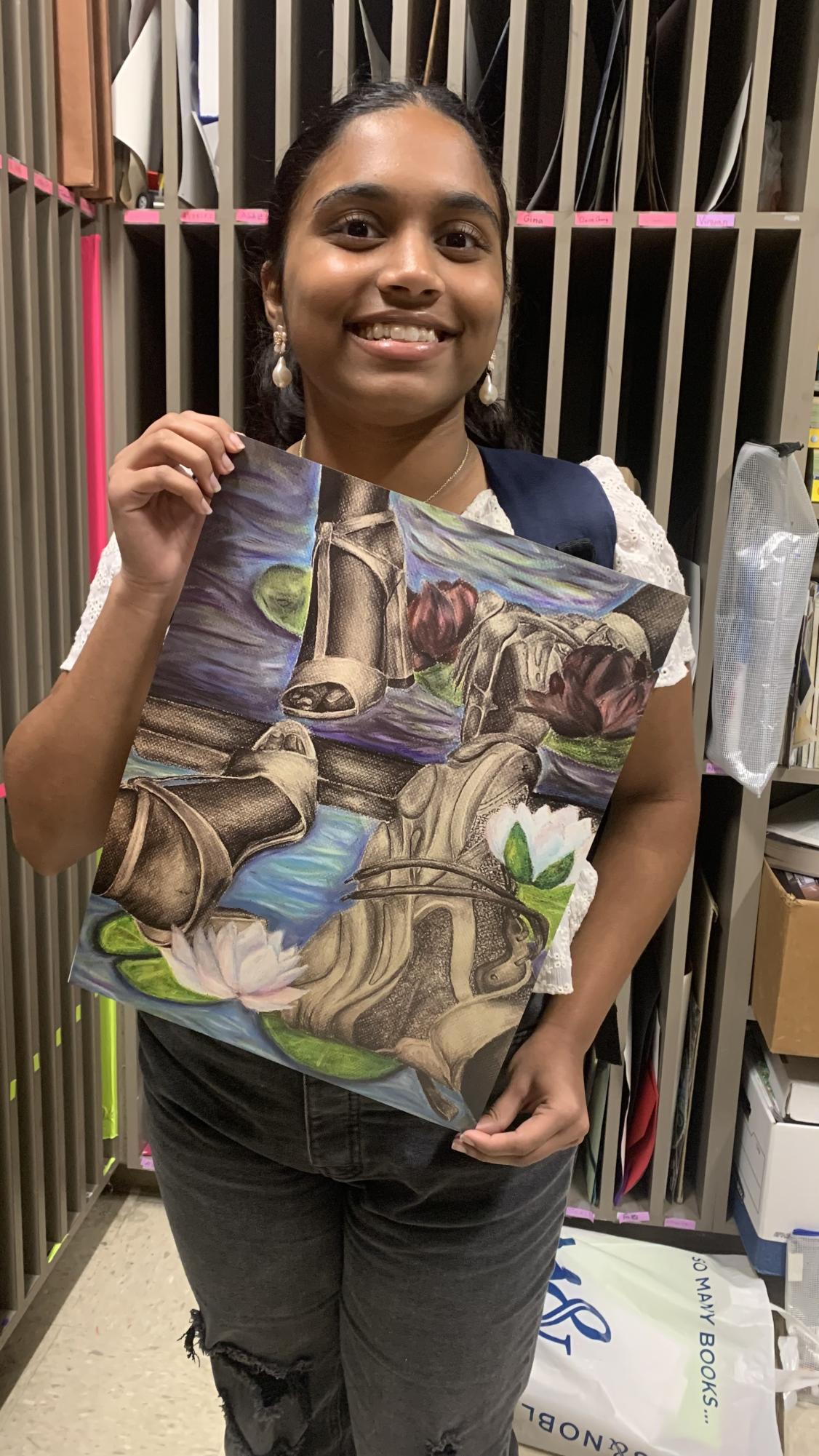 Jayaakiran Bheemarsetti showing off her art piece for the 2024 VASE competition