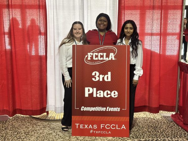 Aaliyah Lolwana poses with her teammates after placing 3rd in the Professional Presentation Level 3 event hosted at the Hilton Anatole in Dallas, Texas.