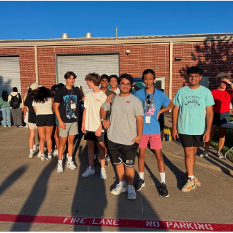 Caption: Seniors enjoying Senior Sunrise in front of the AG building. 