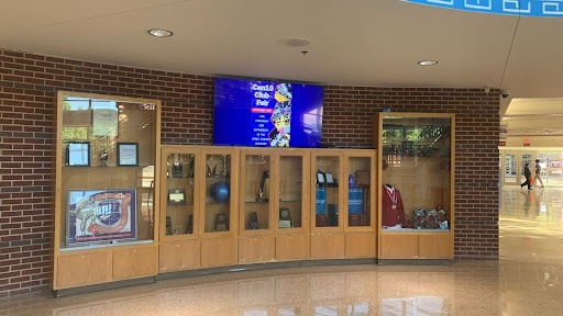 One of the two new TVs in the rotunda, displaying the date for the Club Fair.