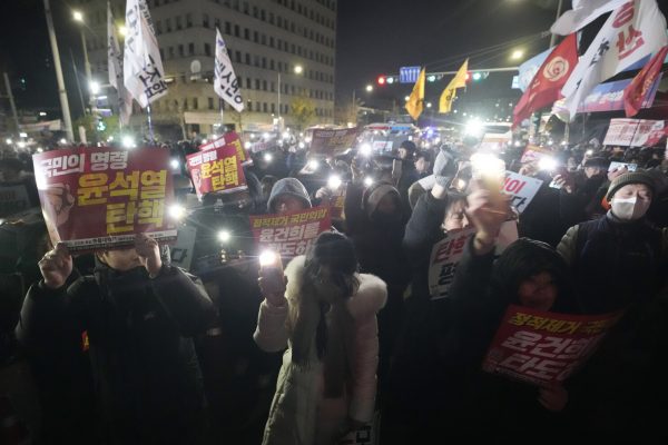 Protestors gathered outside the National Assembly to protest the declaration of martial law, demanding it be lifted immediately.