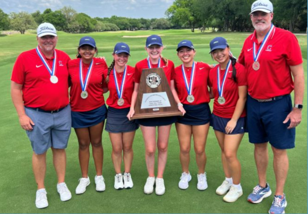 Girls Golf with their trophy at the State tournament.