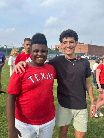 Zechariah Thomas and Boston Cross posing for a picture during Centennial Best Buddies’ annual Kickball Game.
