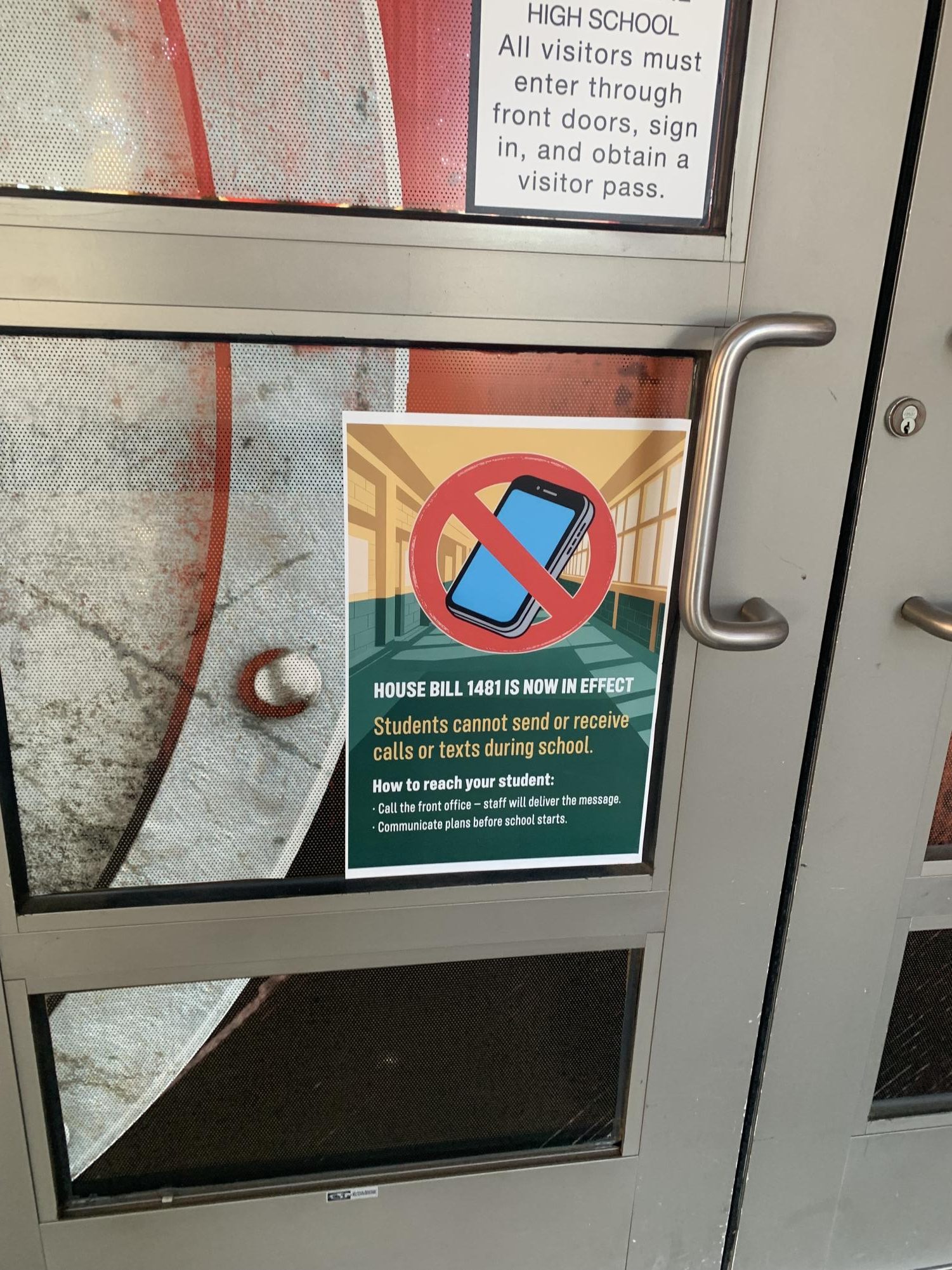A poster reminding students outside of the school to make sure to turn off all their devices. 