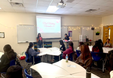 A club meeting led by the officers of Sew for Hope