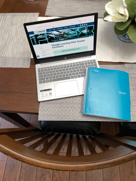 A laptop showing the website for Frisco Flex